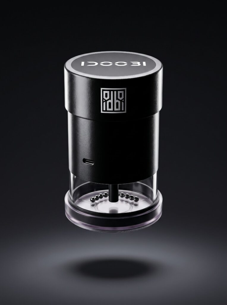 idoobi electric herb grinder against a dark background