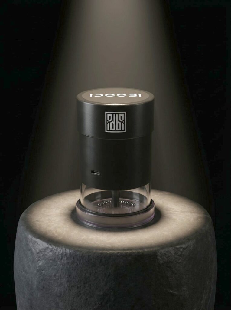 idoobi electric herb grinder on a stone pedestal